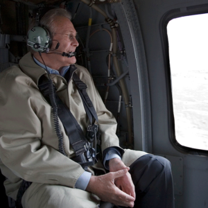 donald rumsfeld sitting in a helicopter looking out window