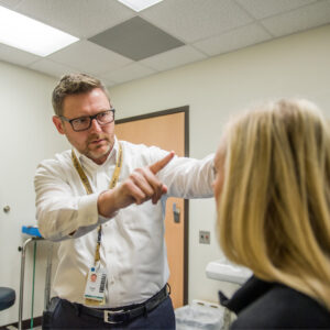 Health care professional helps a patient